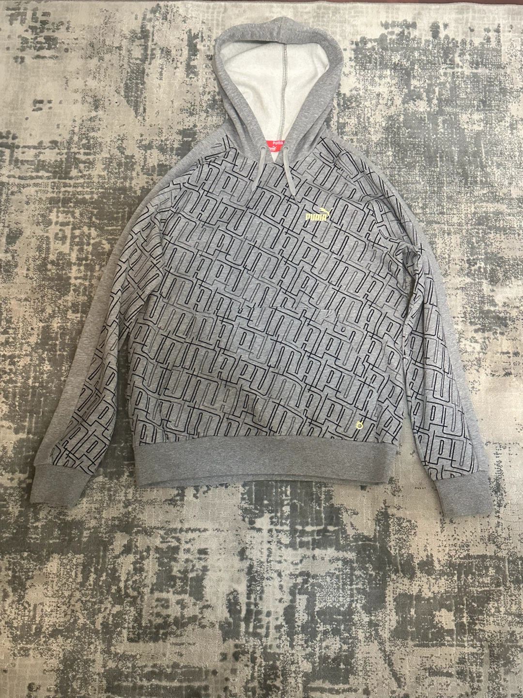 Puma grey hoodie with black logo pattern