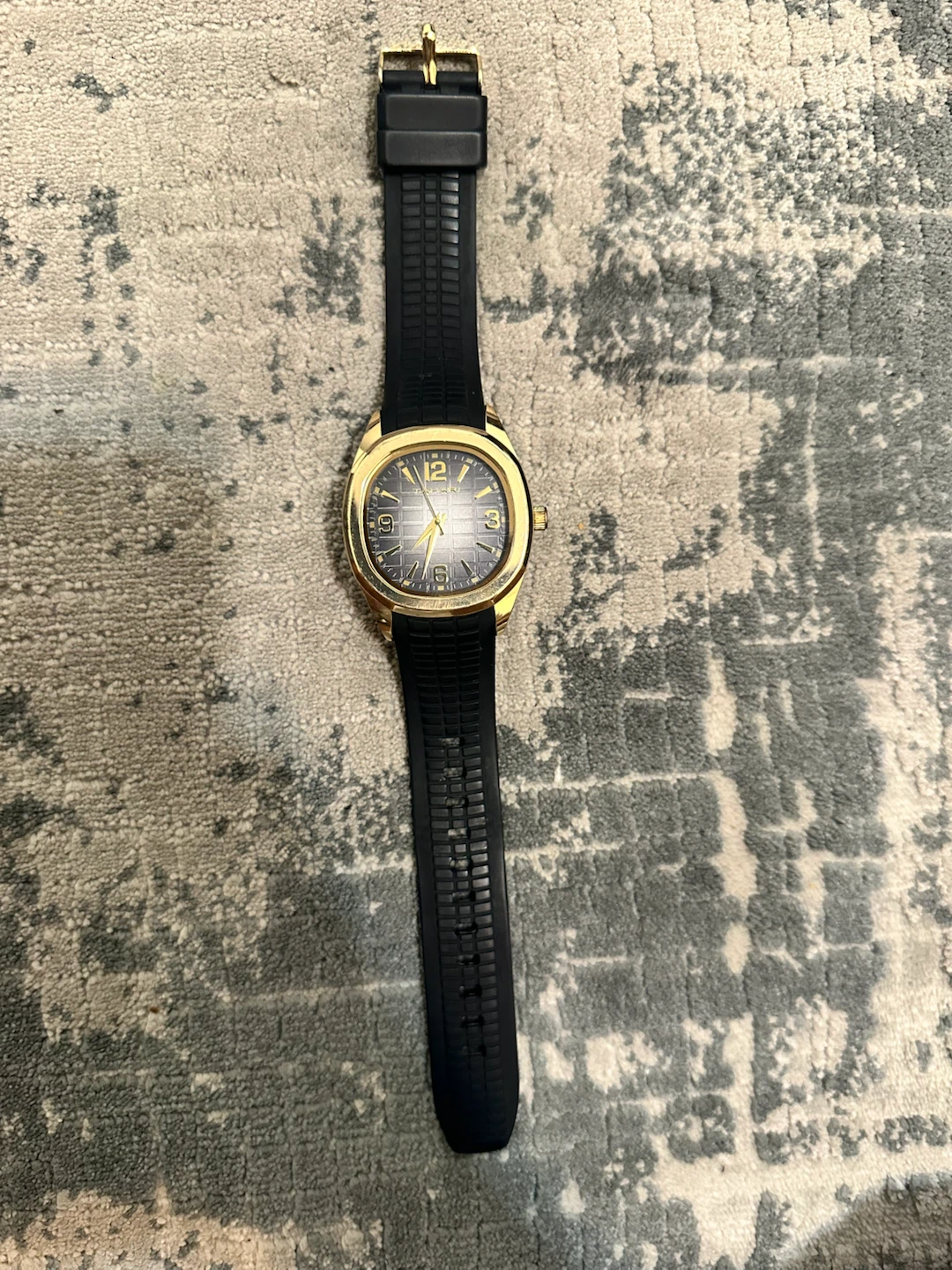 Tahari golden-tone watch with black strap