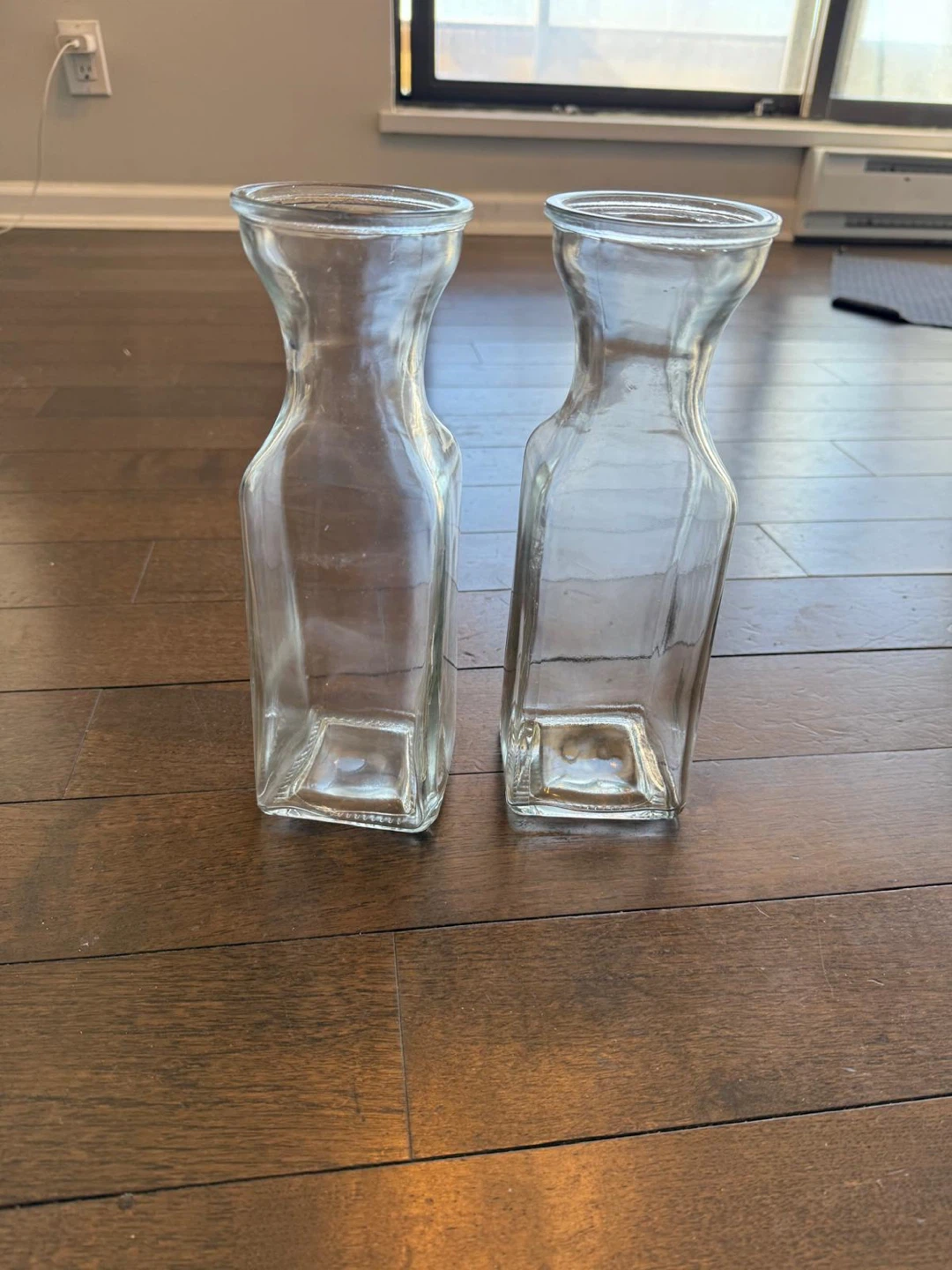 Two clear glass carafes
