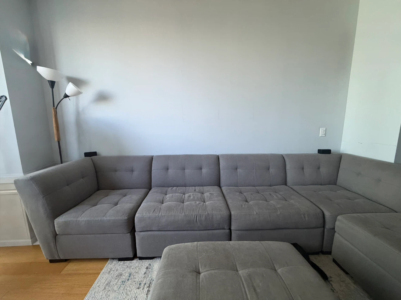 Gray Tufted Sectional Sofa with Ottoman