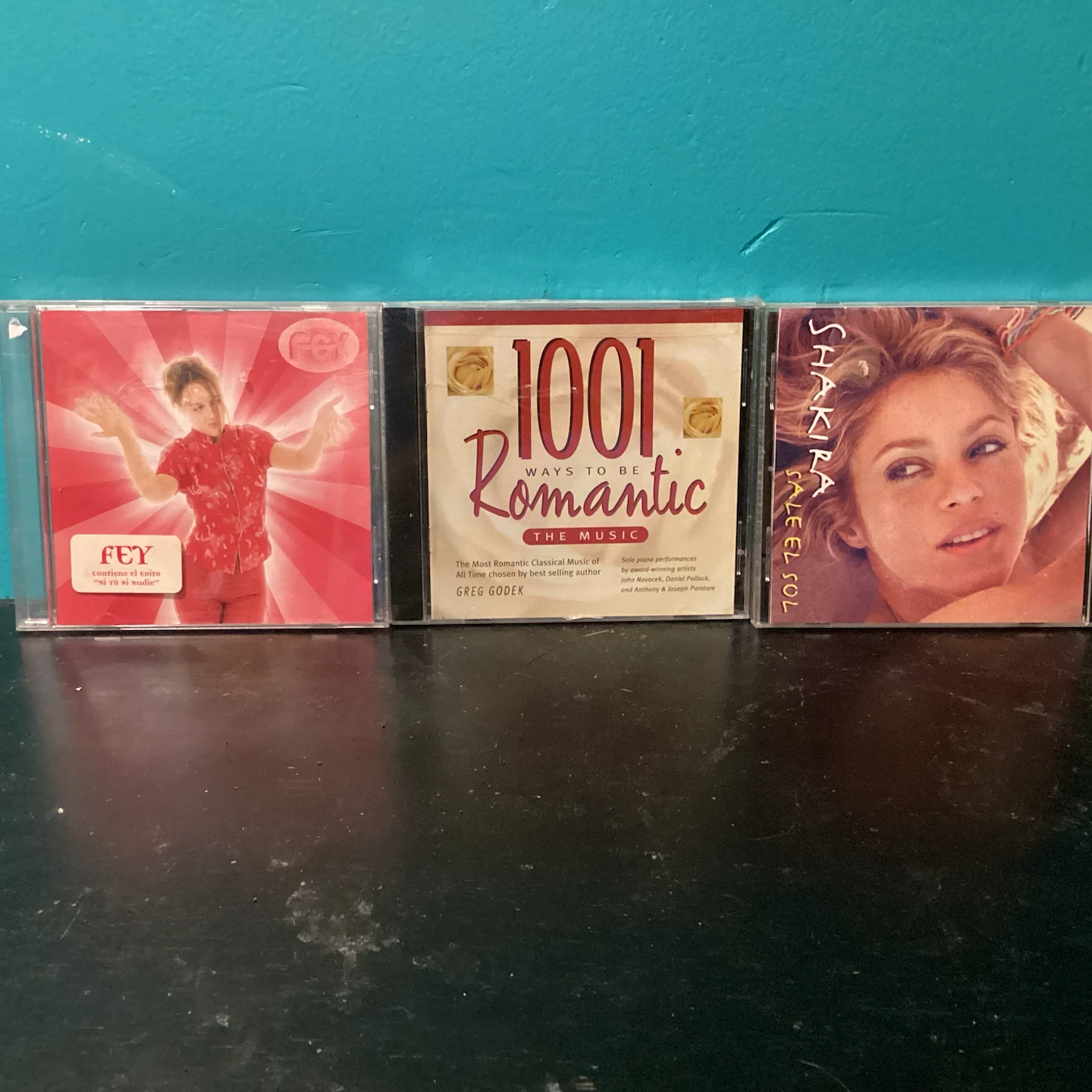 Set of 3 Music CDs - Fey, Shakira, and 1001 Romantic