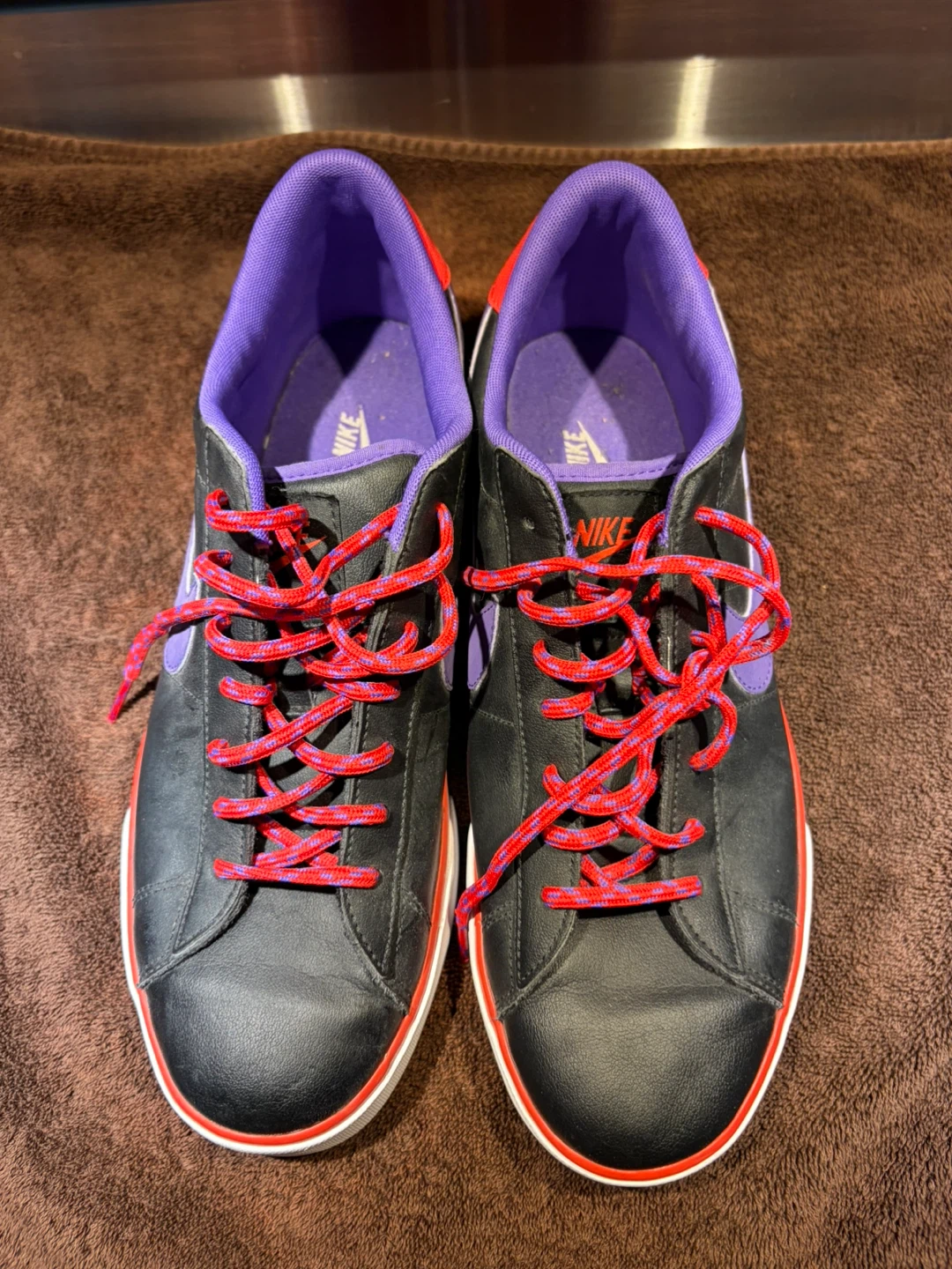 Nike sneakers in black, purple, and red