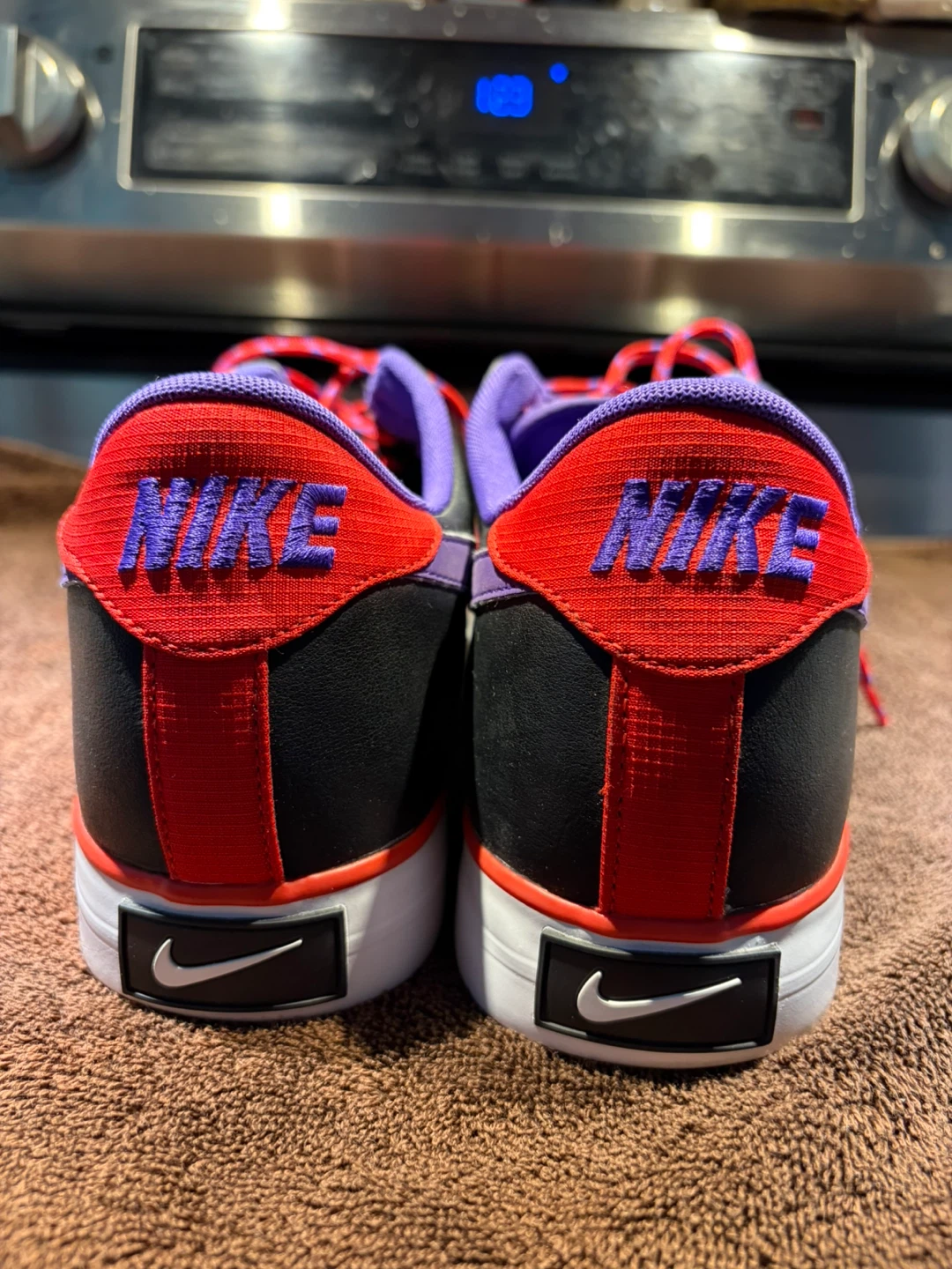 Nike sneakers in black, purple, and red - photo 3