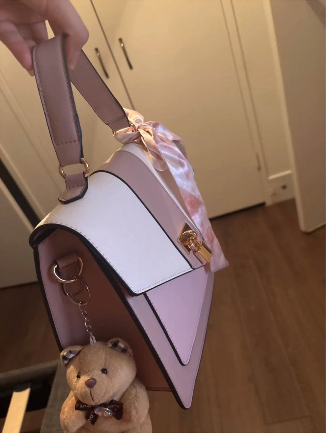 Pink and white handbag with bow