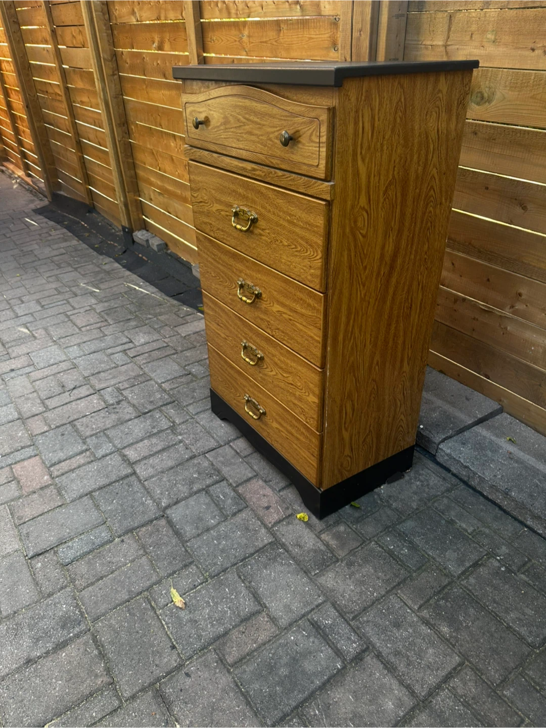Solid wood 5‑drawer dresser in great condition.
