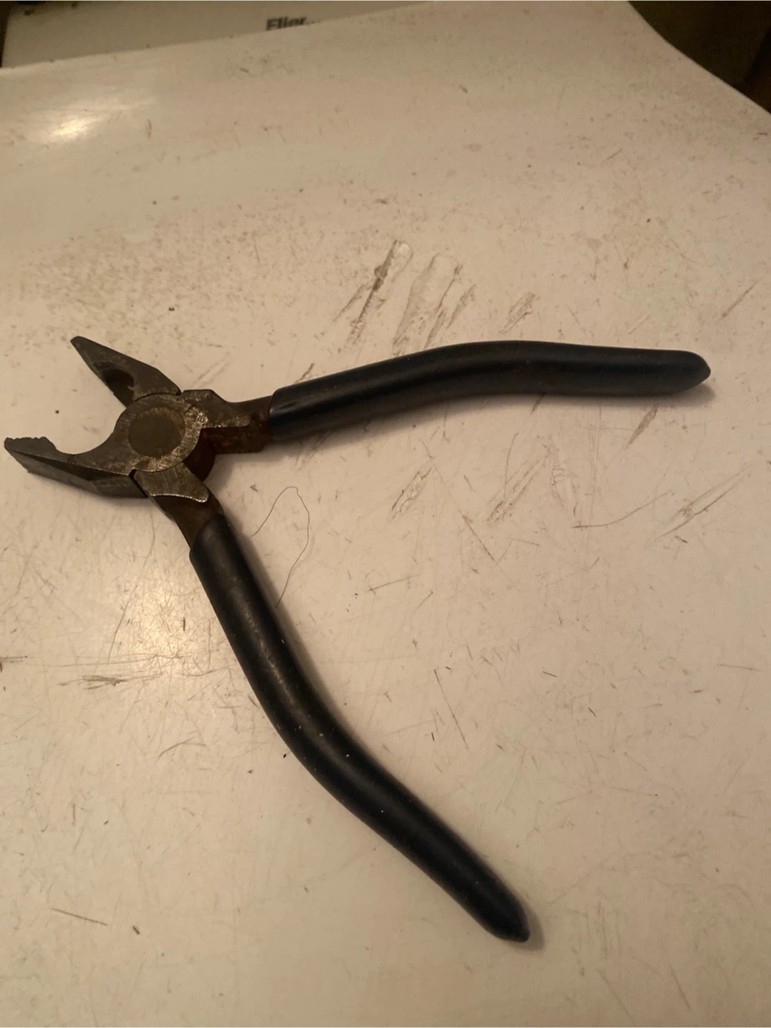 Metal Pliers with Black Handles