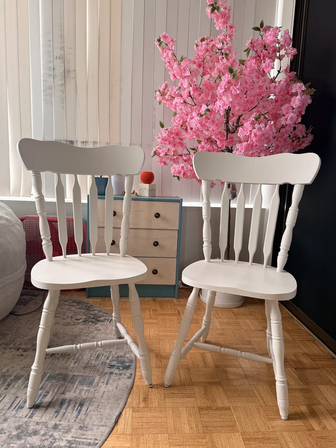 Set of two white spindle back chairs
