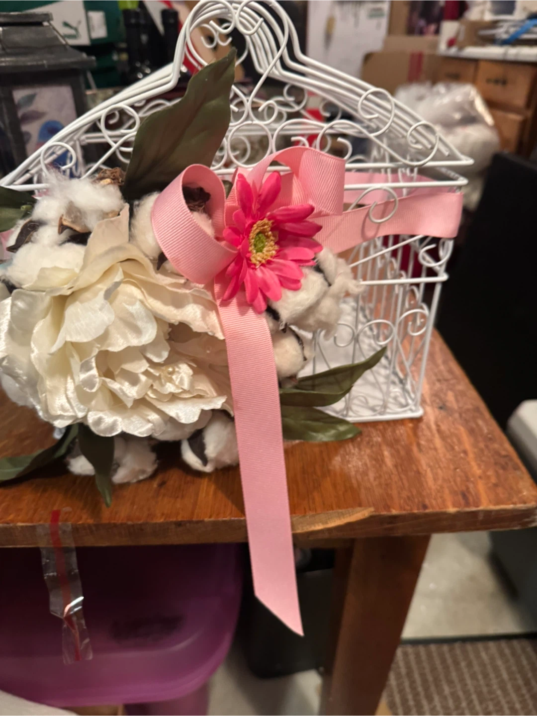 Decorative white wire birdcage with flowers