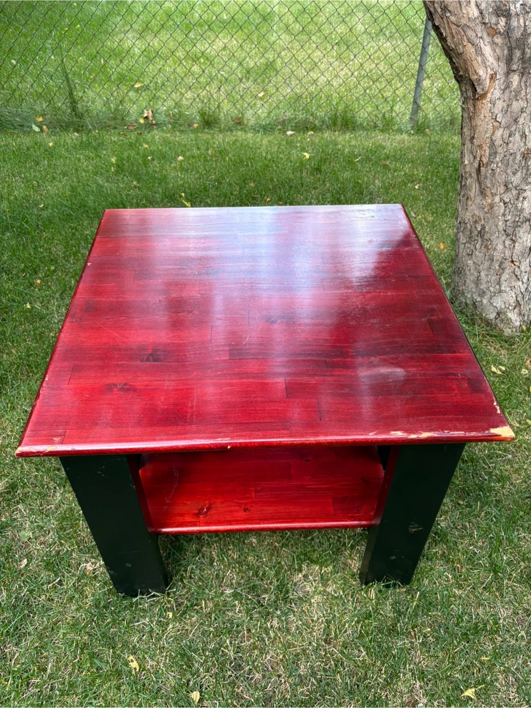 Red and black wooden side table