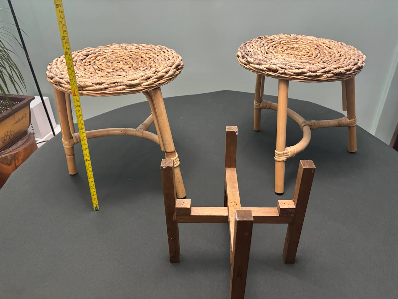 Two Woven Rattan Stools and Wooden Plant Stand