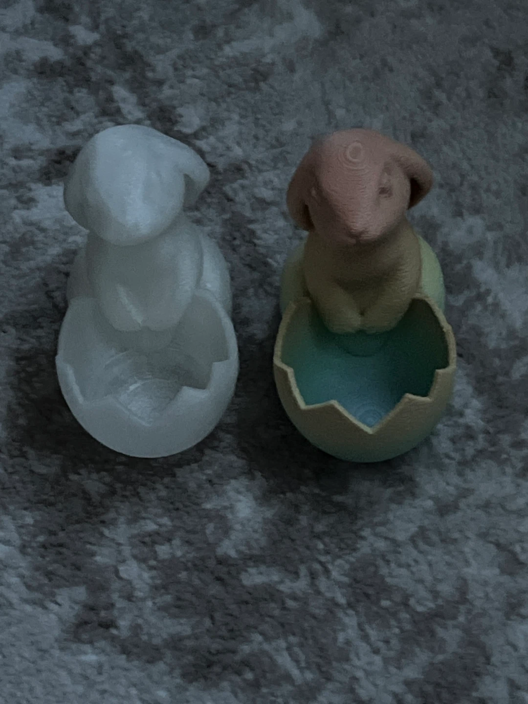 Two 3D printed bunny egg figurines