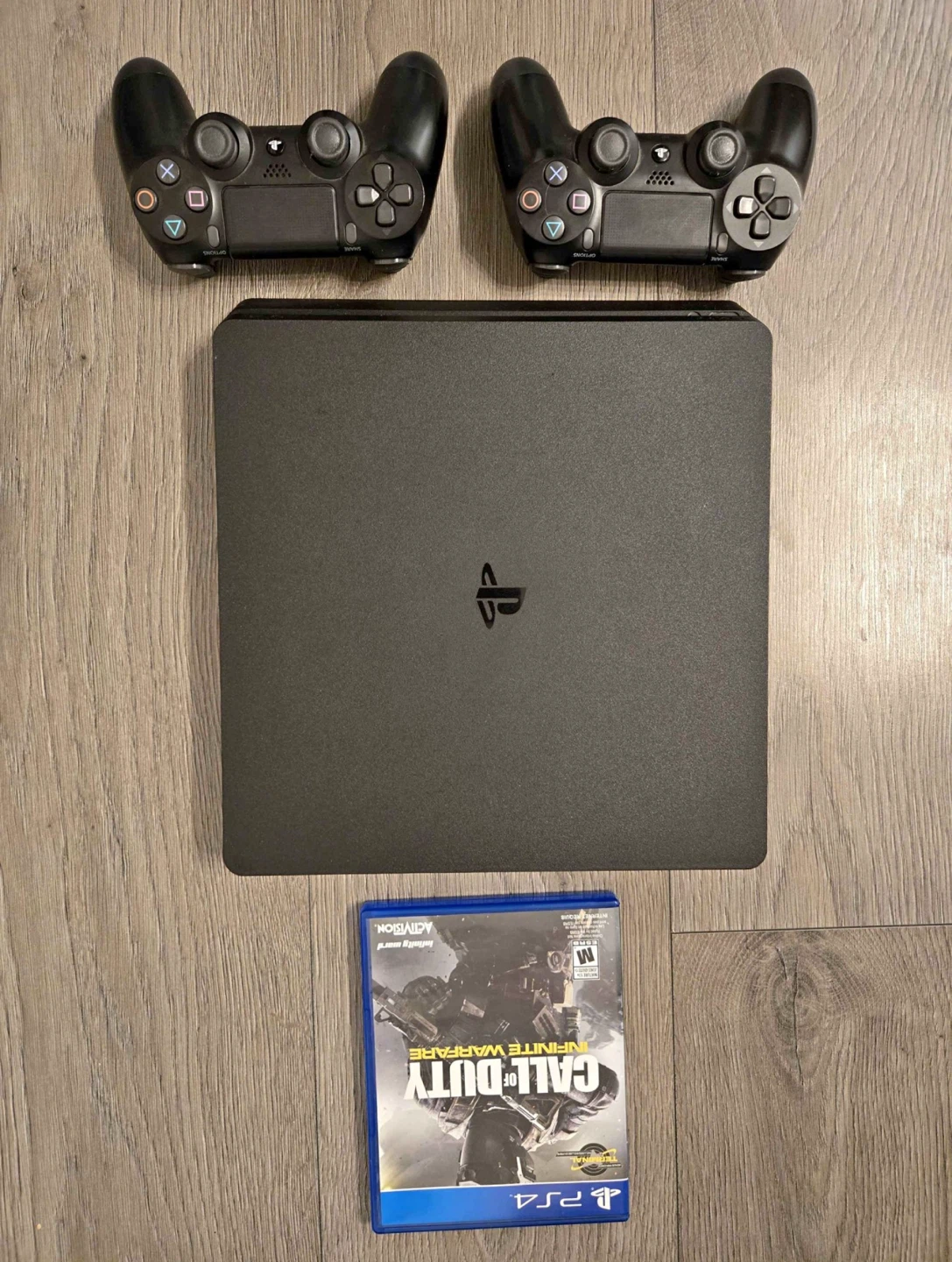 PlayStation 4 Slim Console with 2 Controllers and Game