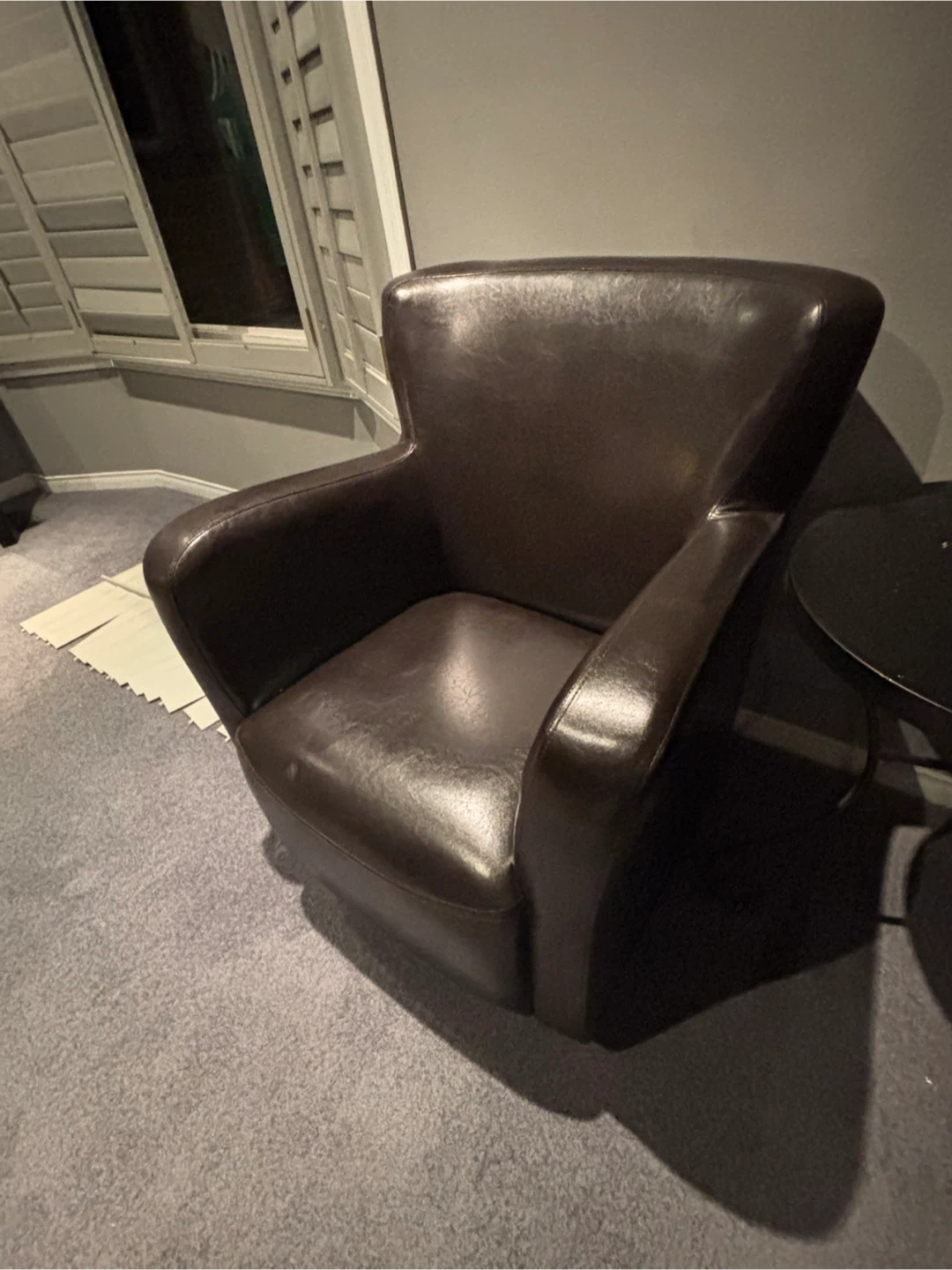 Dark brown faux leather armchair