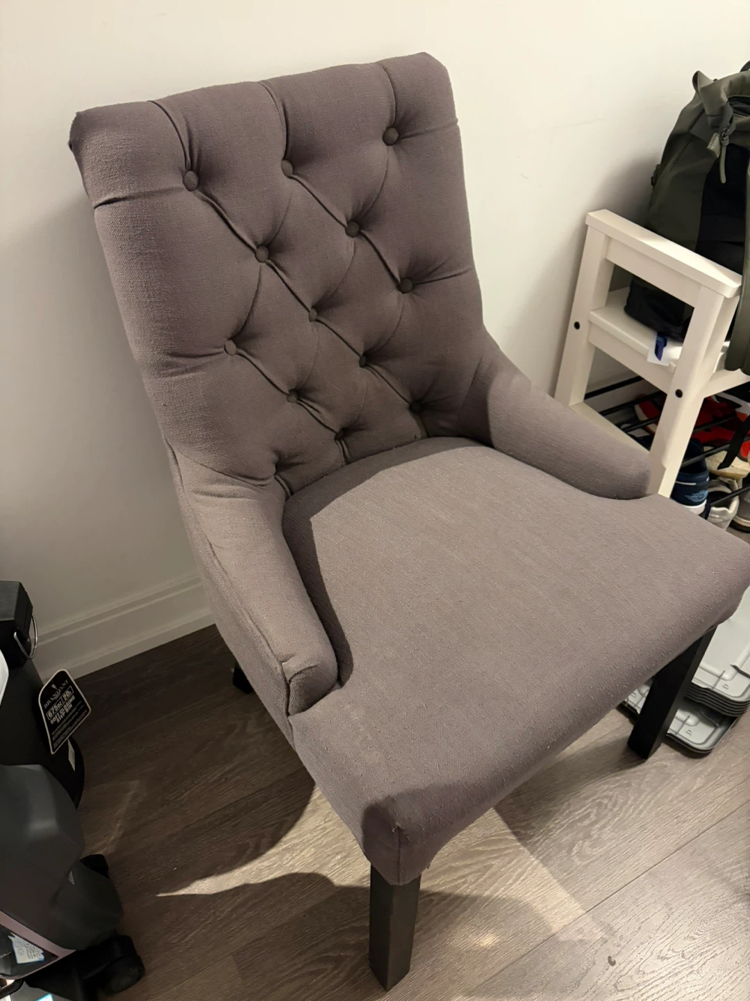 Grey tufted accent chair