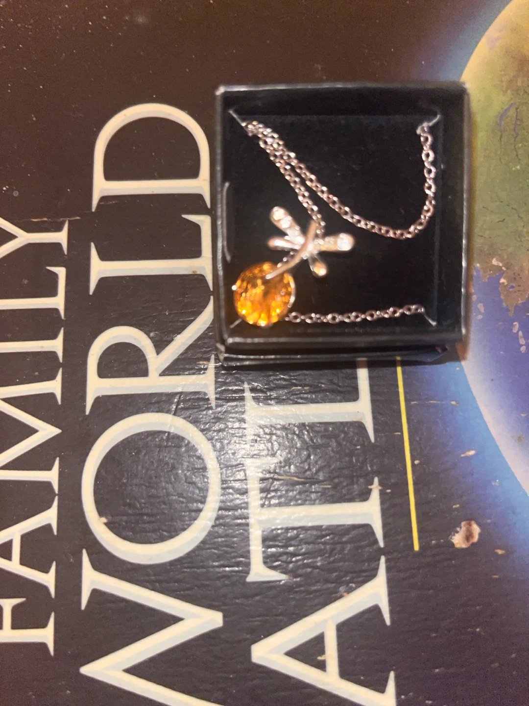 Dragonfly pendant necklace with amber-coloured stone