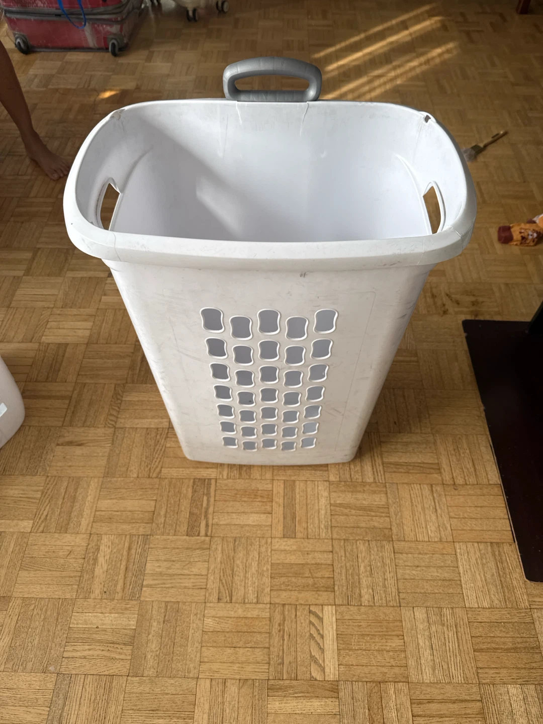 White plastic laundry basket