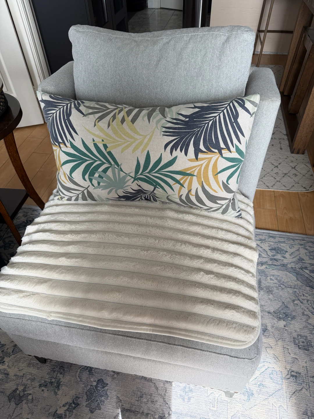 Light grey upholstered armchair