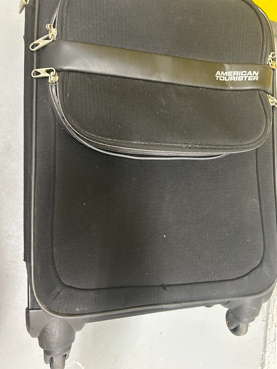 American Tourister black carry-on luggage