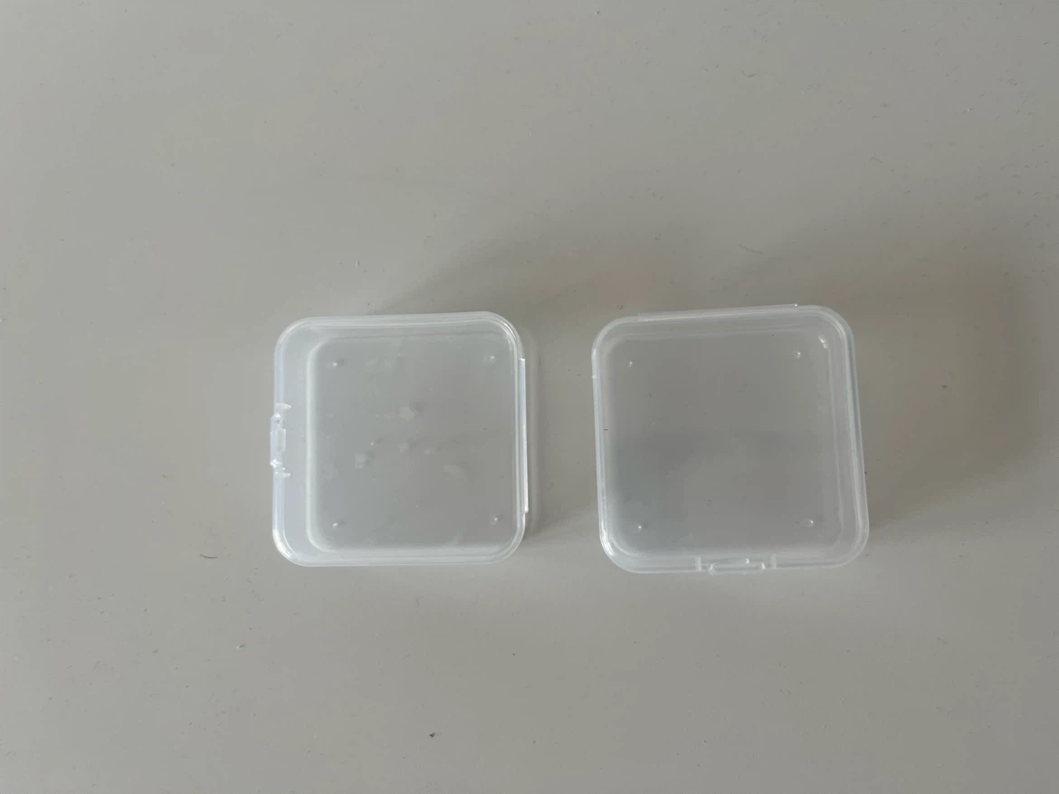 Two Small Clear Plastic Containers