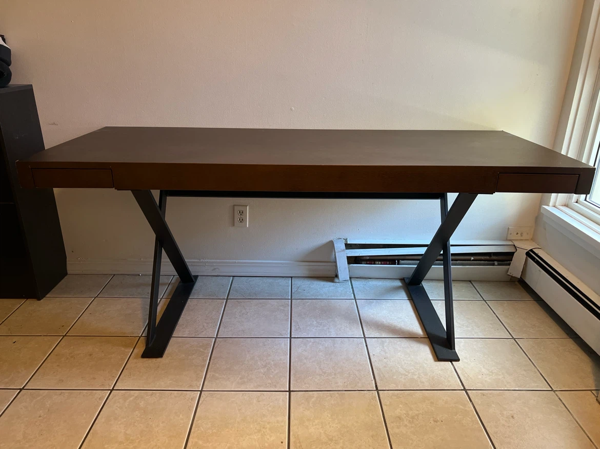 Modern dark wood desk with X-frame legs