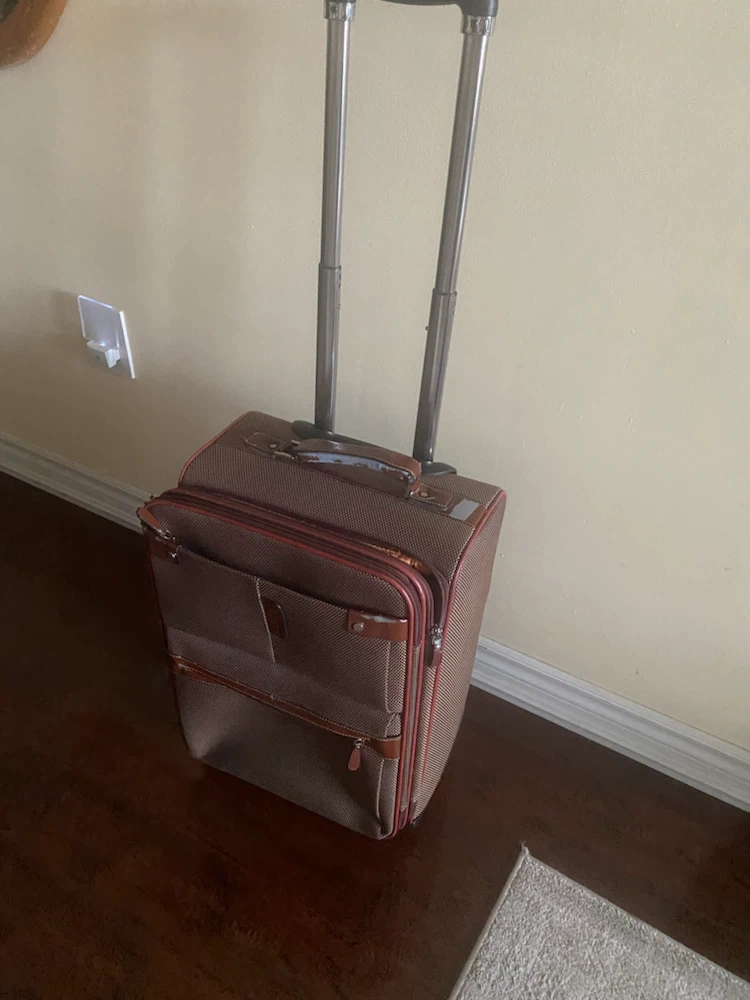 D.X. Polo rolling carry-on suitcase