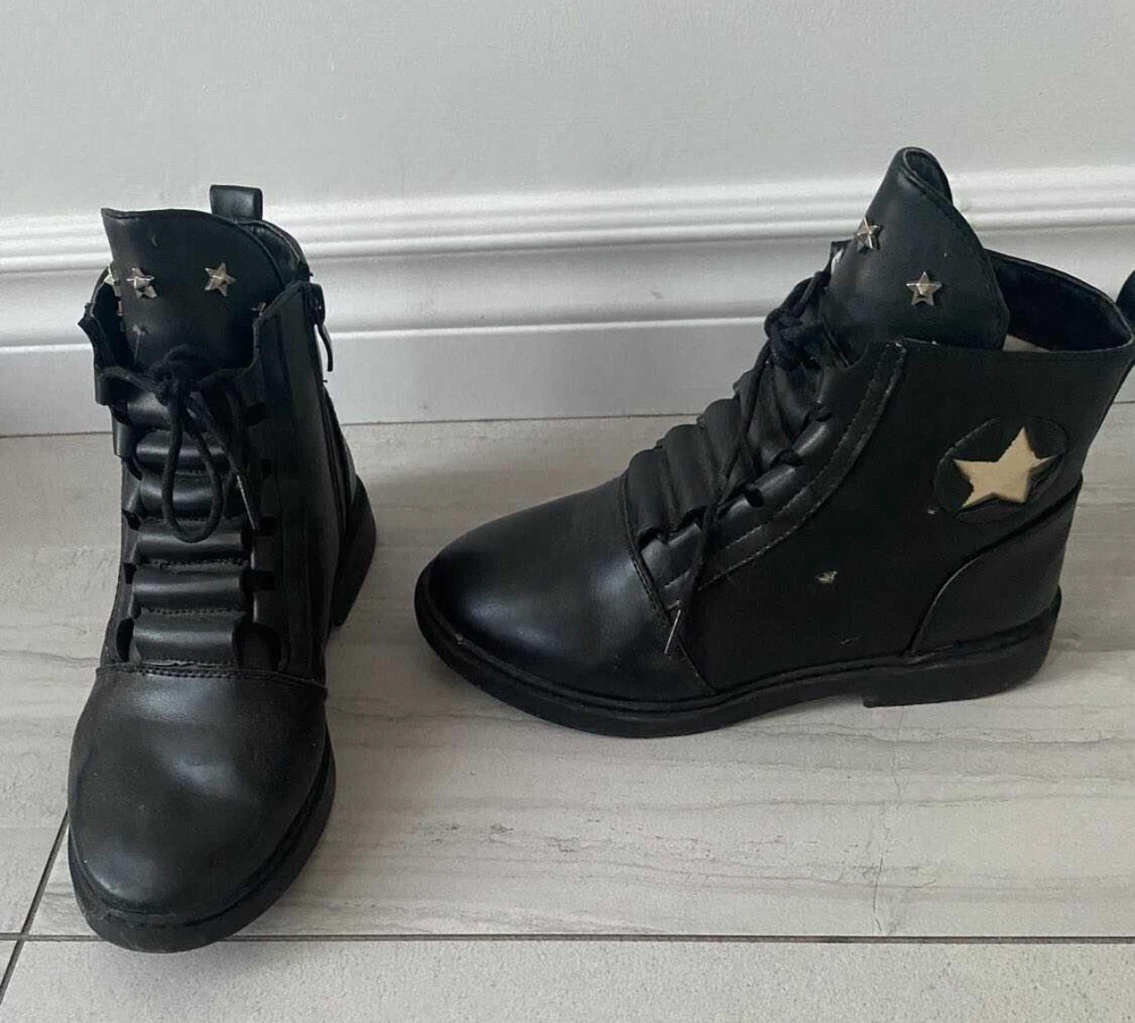 Black ankle boots with star detail