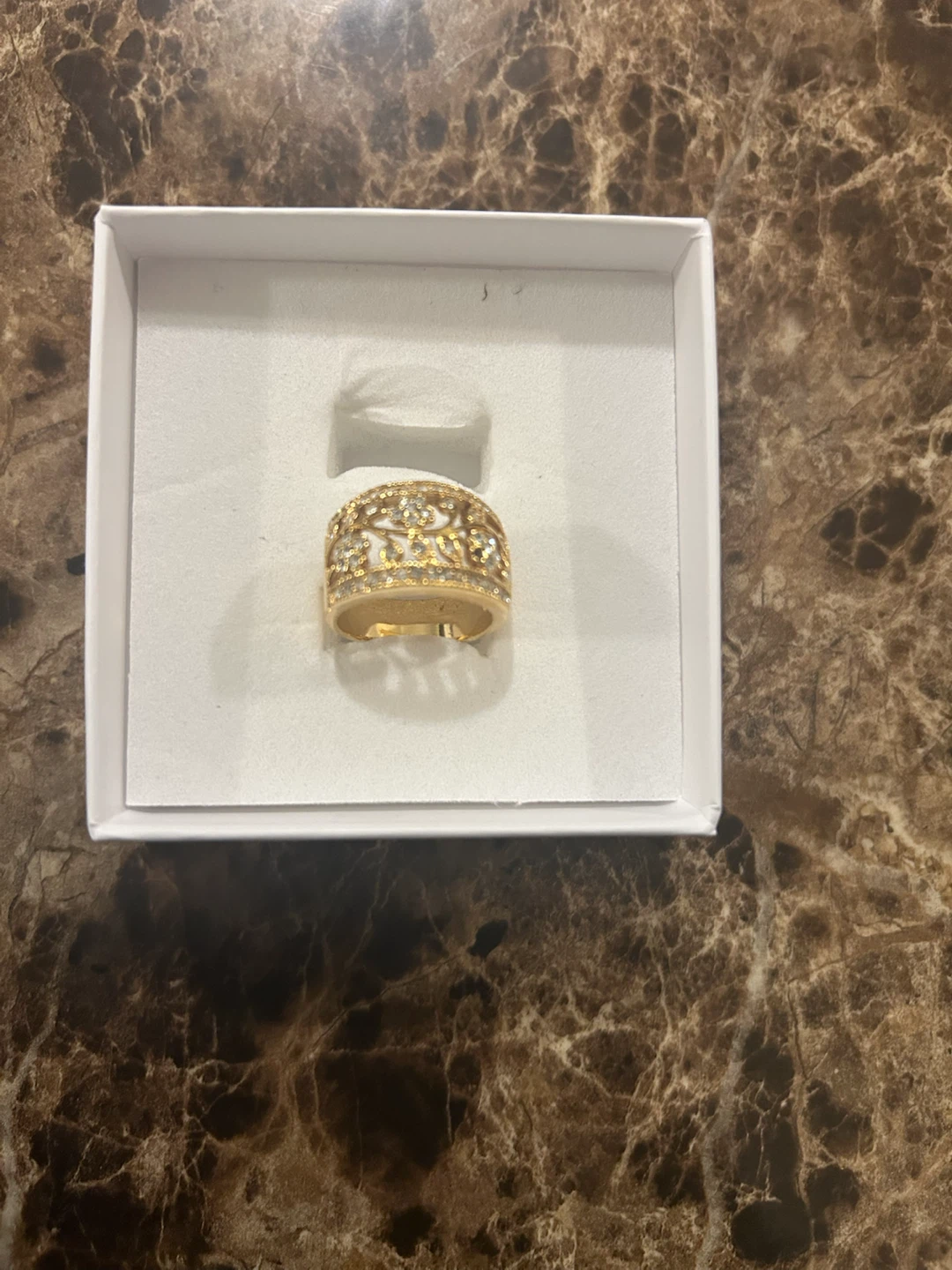 Gold-tone filigree ring with stones