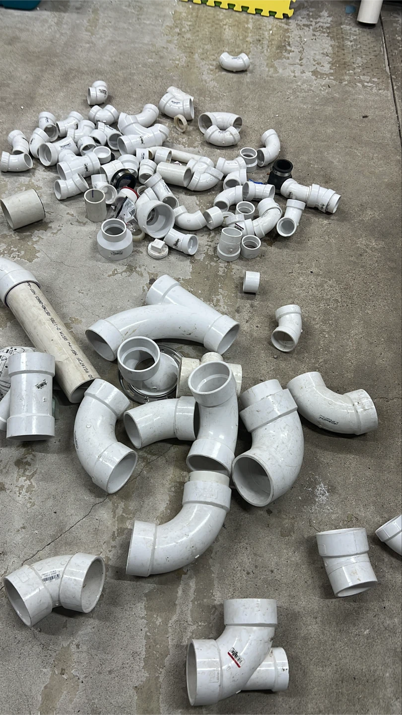 Assorted PVC Plumbing Fittings and Pipe Pieces