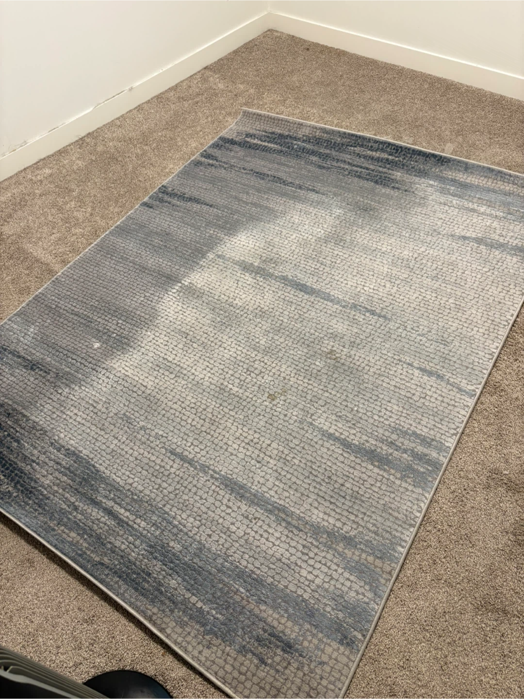 Blue and grey patterned area rug