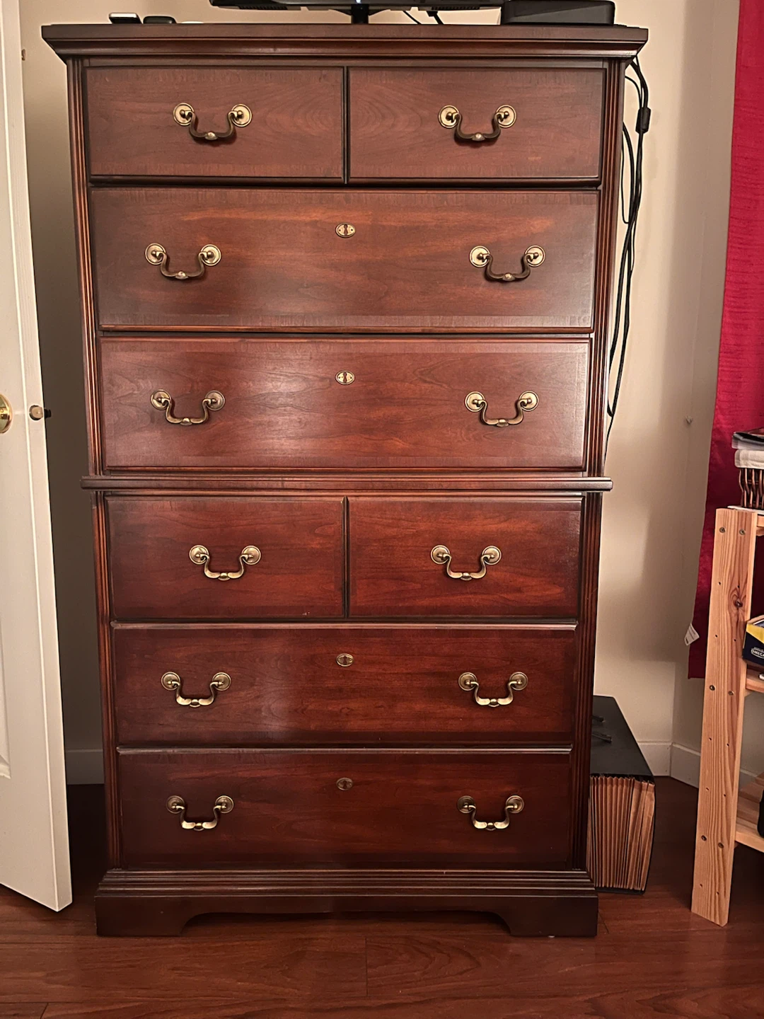 Tall wooden dresser with drawers