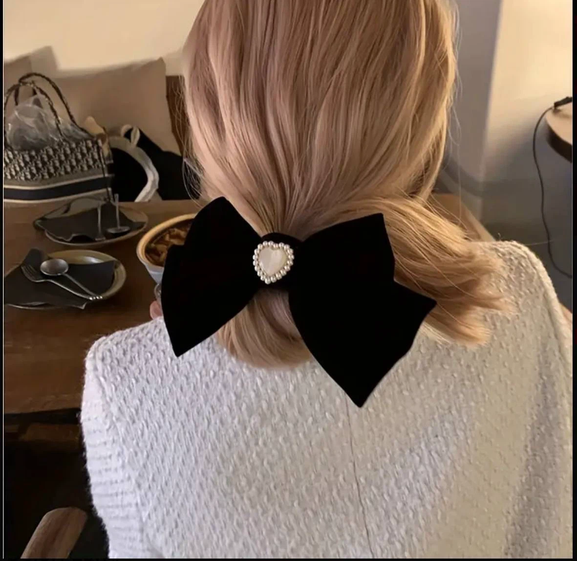 Black velvet bow with a pearl heart