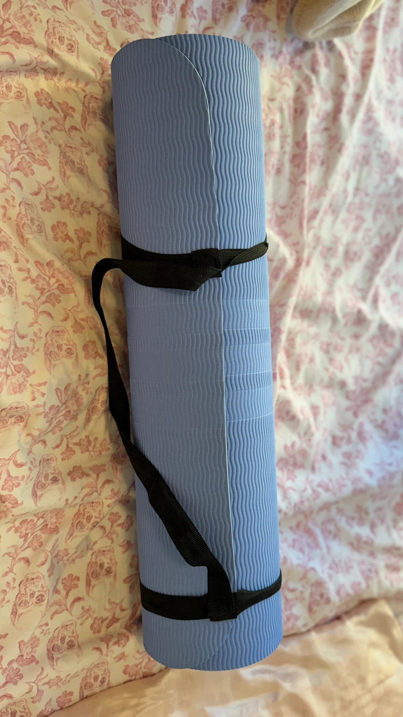 Light blue and black Adidas yoga mat with carry strap