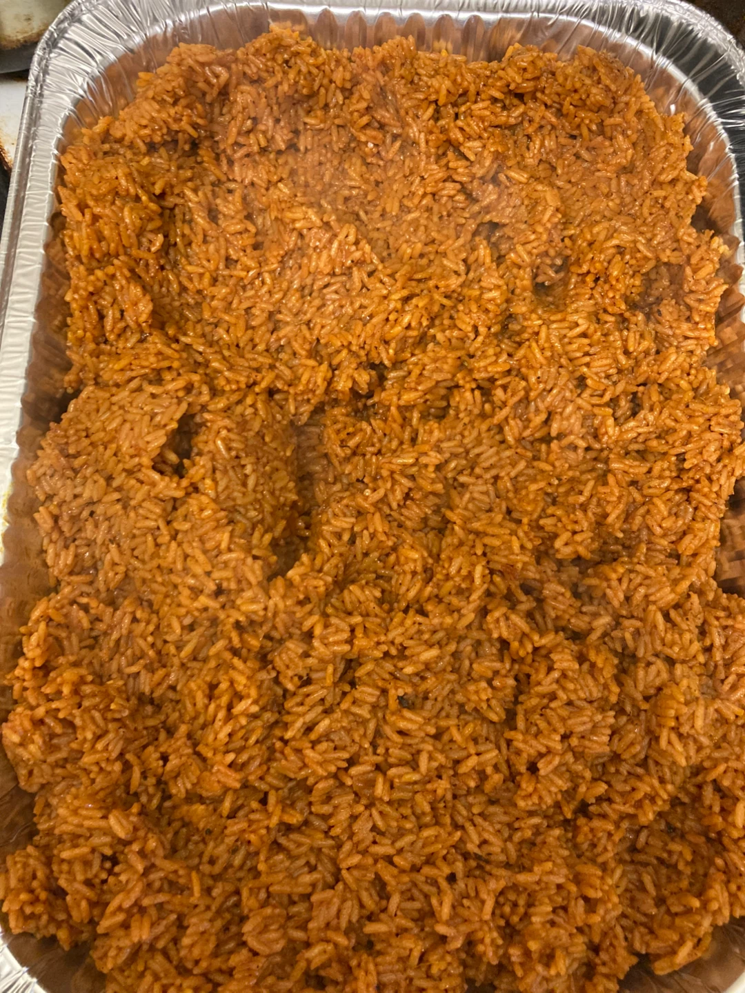 Trays of Jollof spaghetti and stir fried noodles available