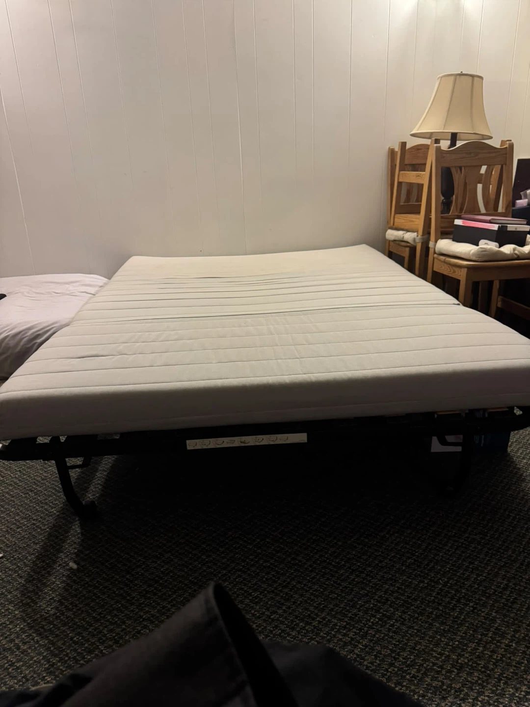 Convertible sofa bed with black metal frame