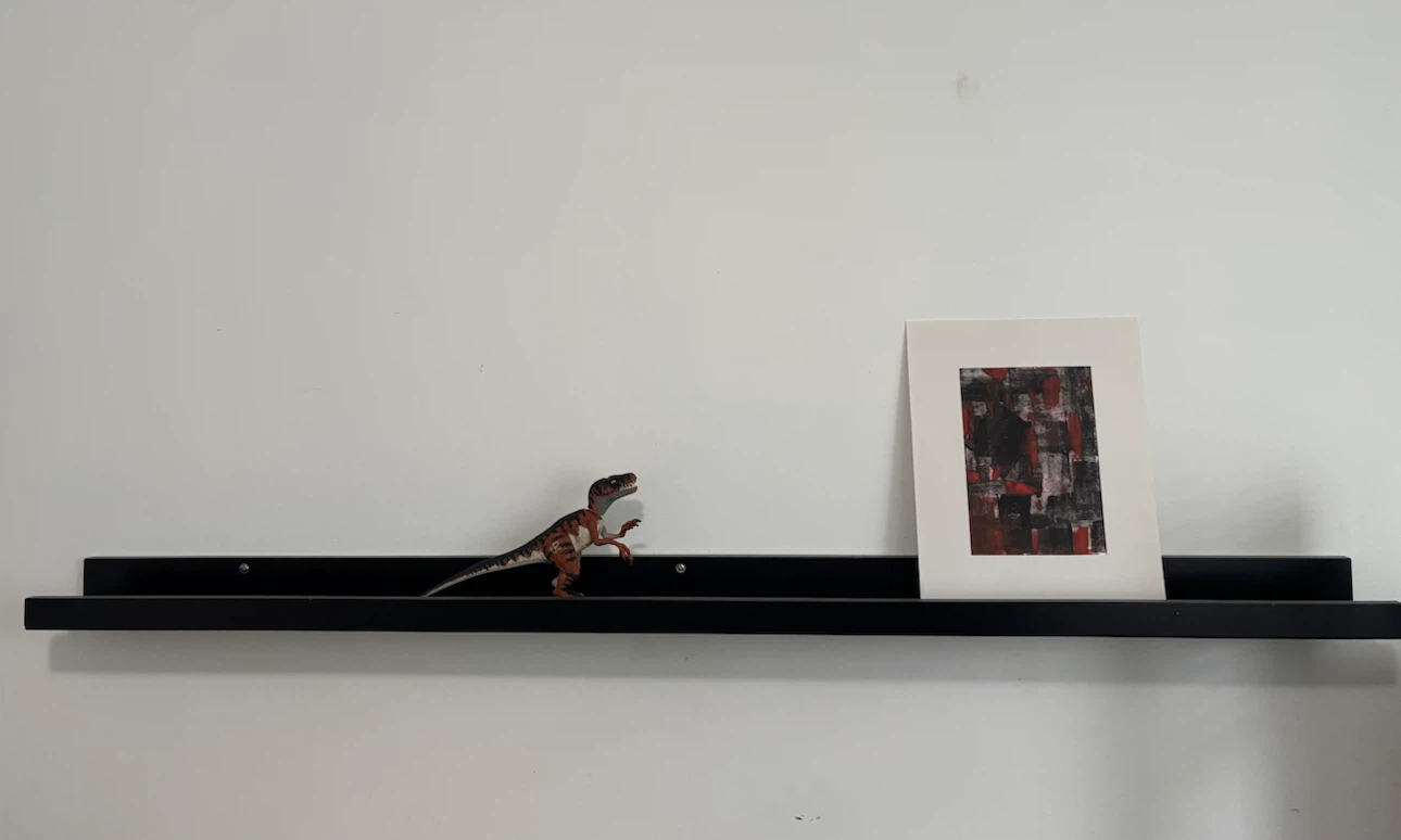 Black wall-mounted floating shelf