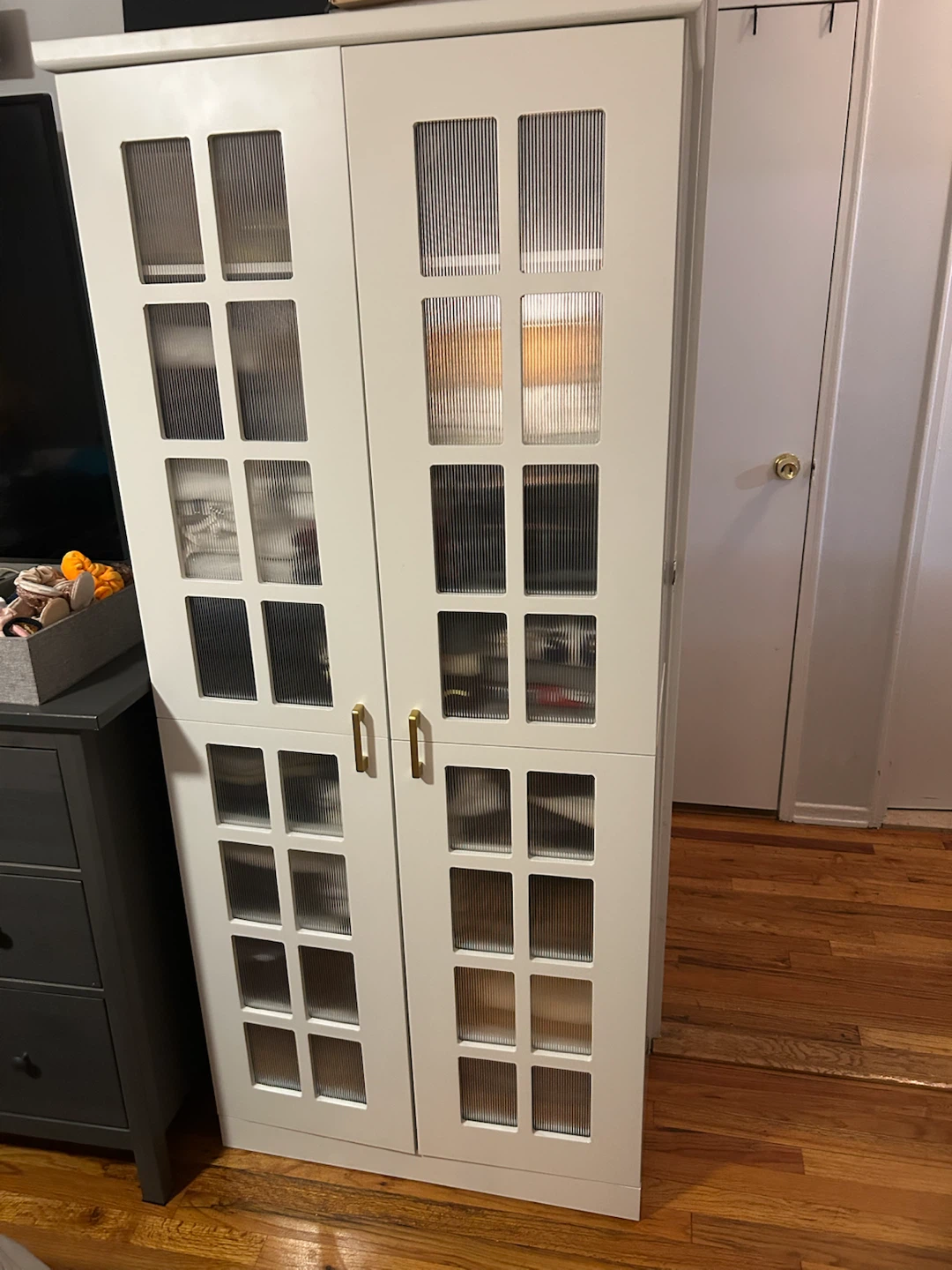 White Storage Cabinet with Fluted Glass Doors