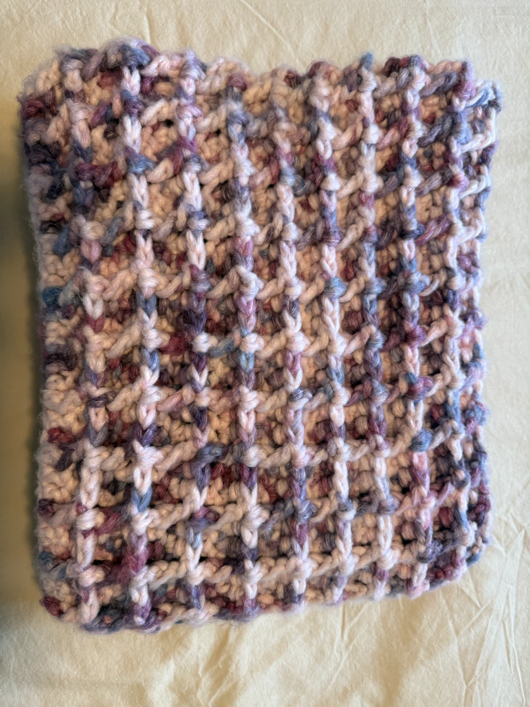 Hand-crocheted multicoloured waffle stitch blanket