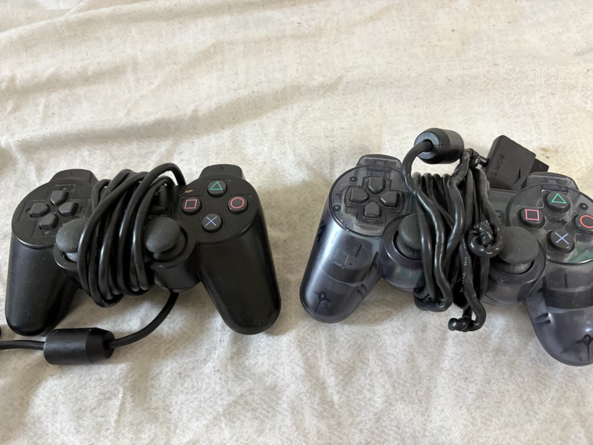 Two Sony PlayStation 2 Wired Controllers