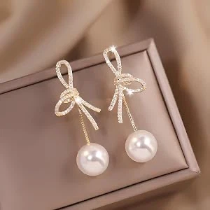 Crystal bow and pearl drop earrings
