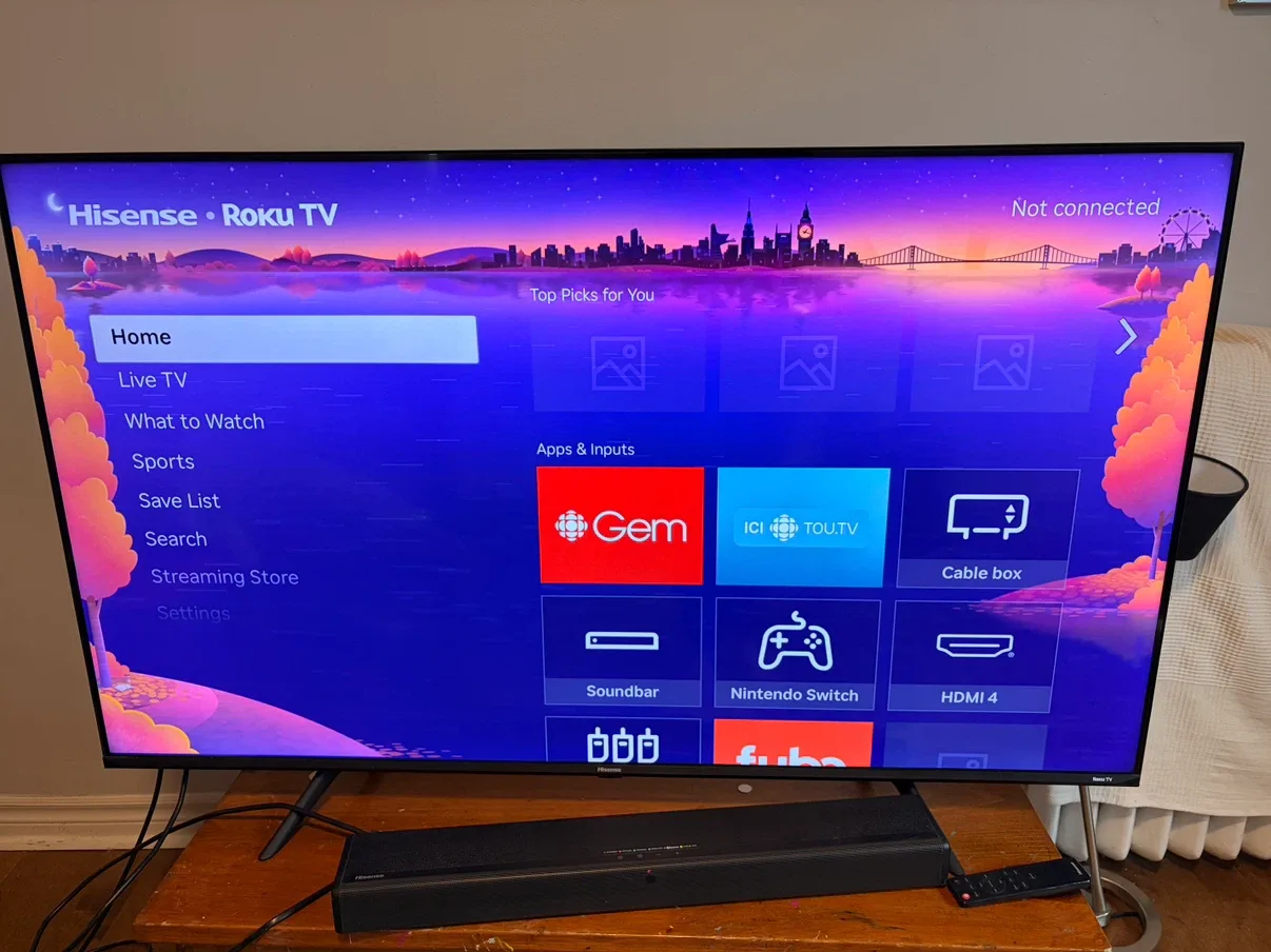 Hisense Roku TV with an attached soundbar