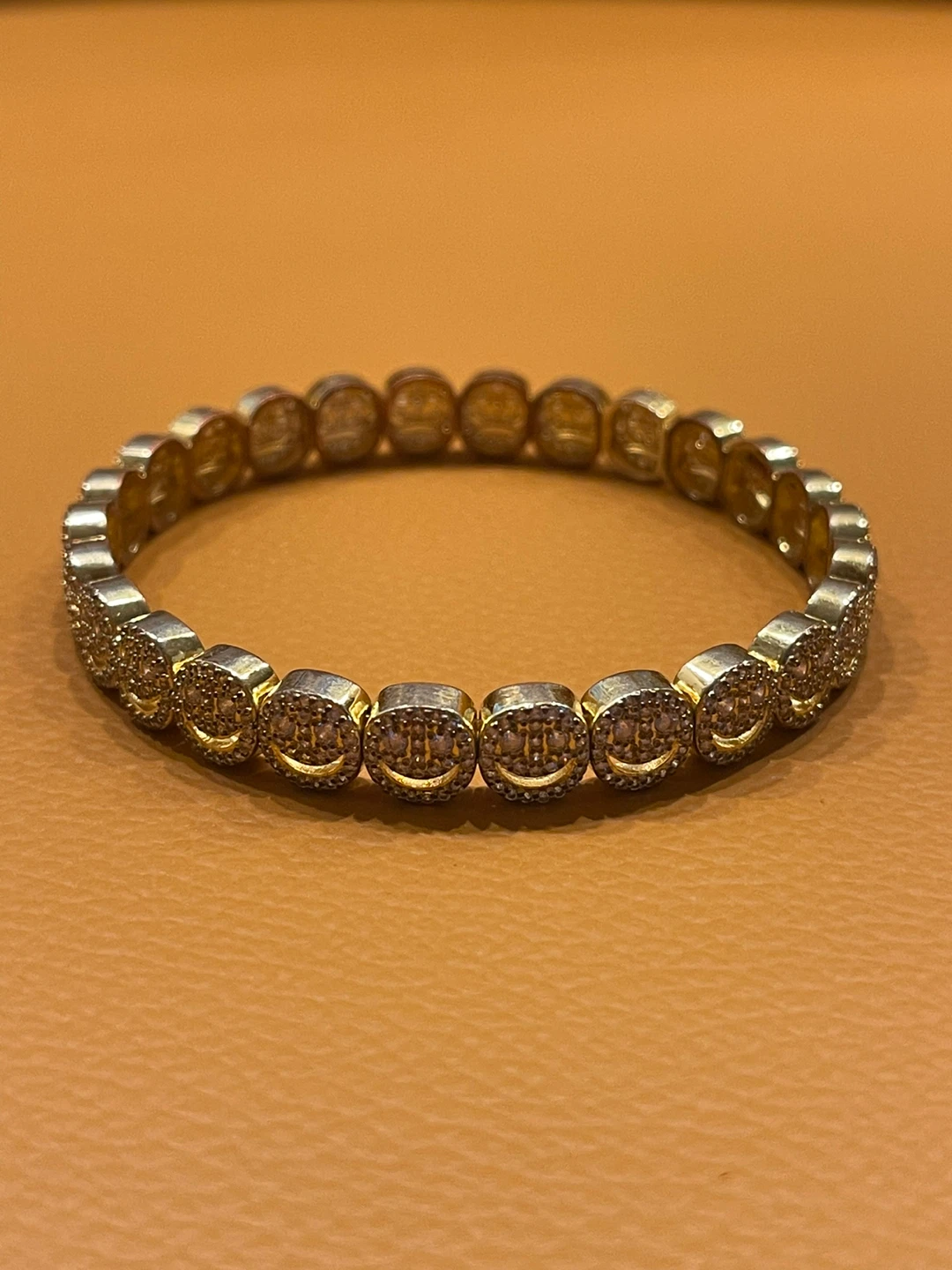 Gold-tone smiley face bracelet