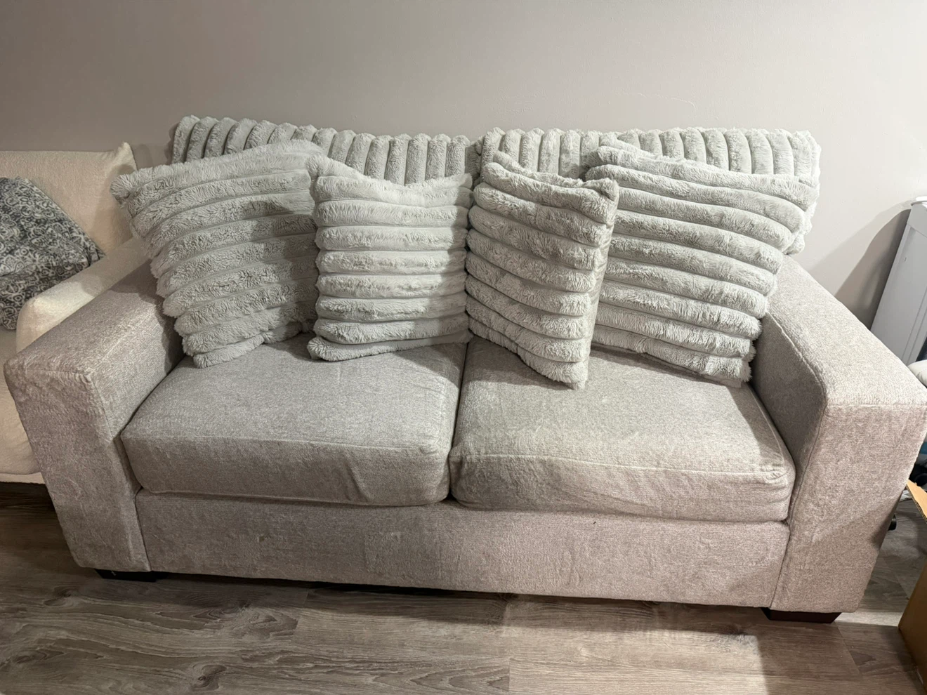 Light gray loveseat and matching armchair
