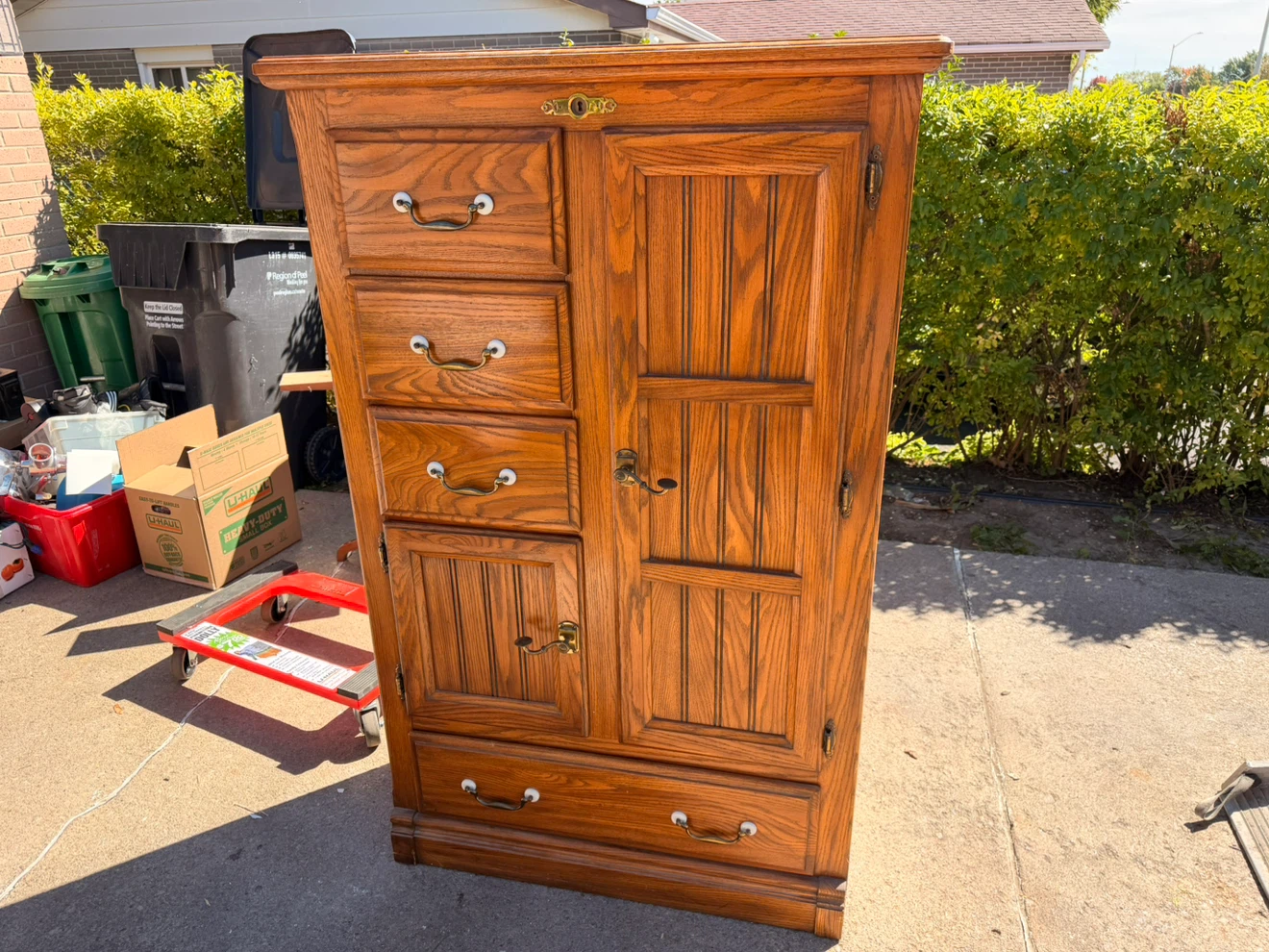 Oak storage cabinet with drawers and shelves