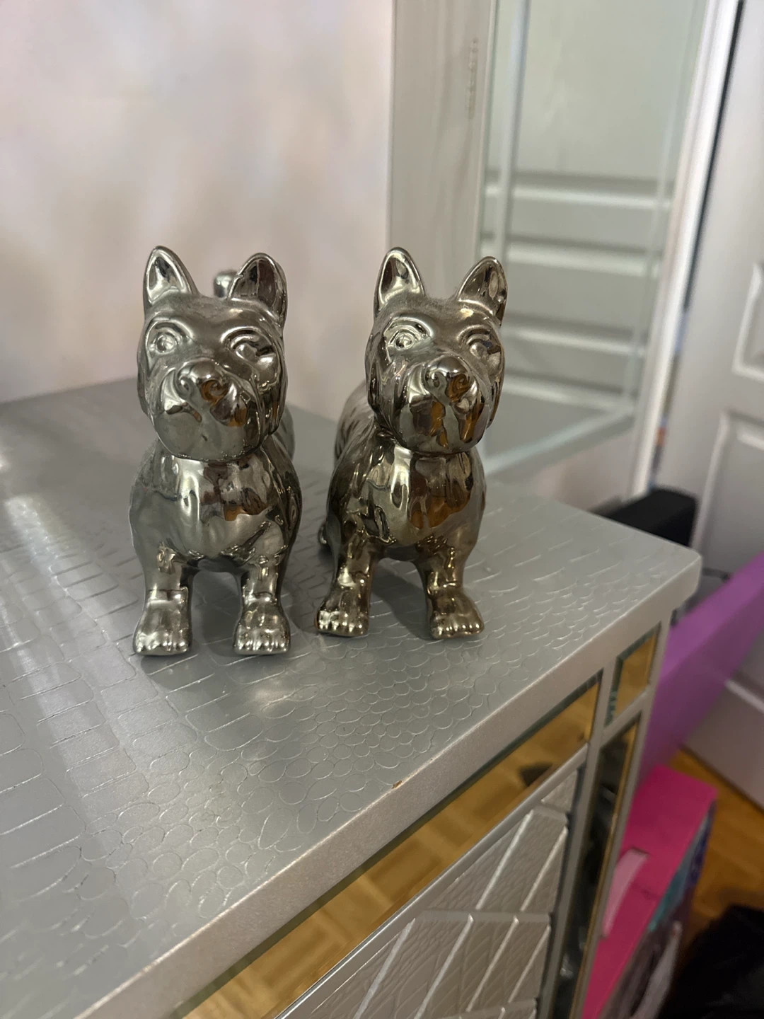 Set of two silver metallic dog figurines