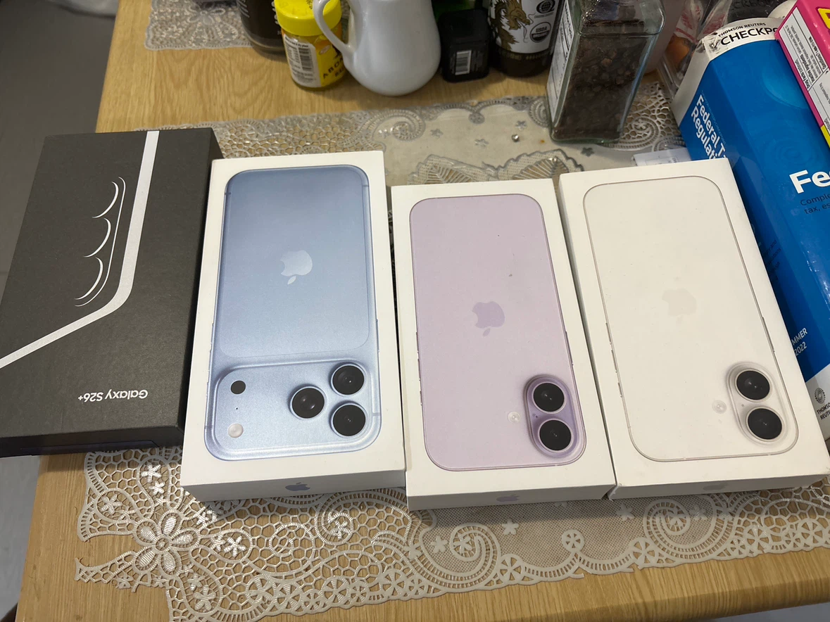 Empty iPhone and Galaxy S26+ Boxes