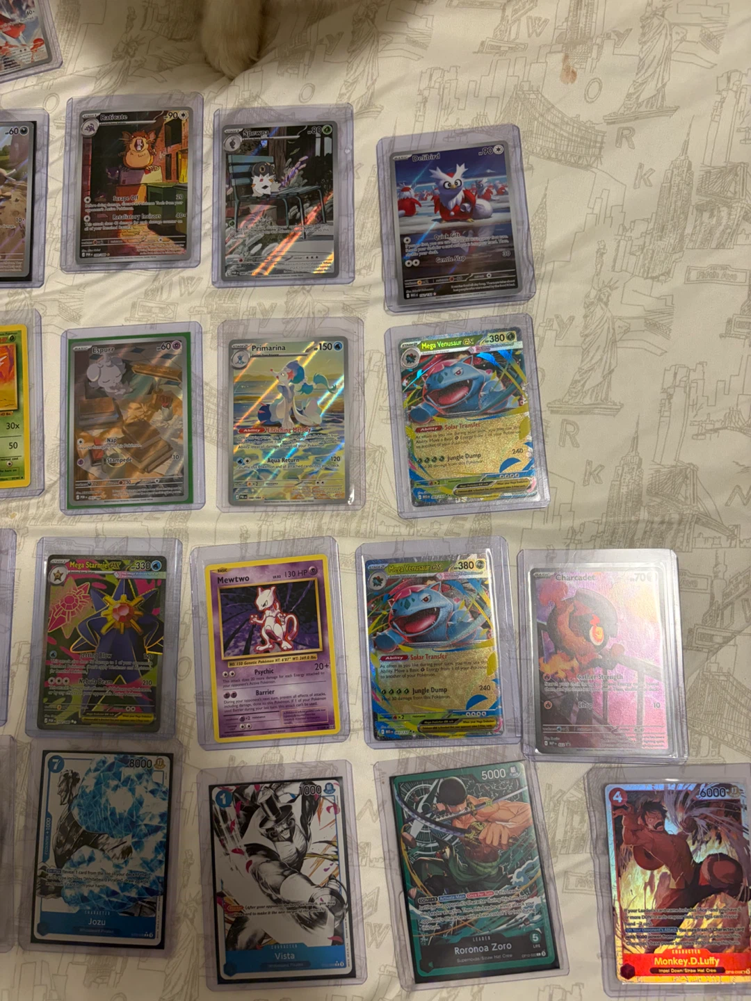 Assorted Pokemon and One Piece Trading Cards