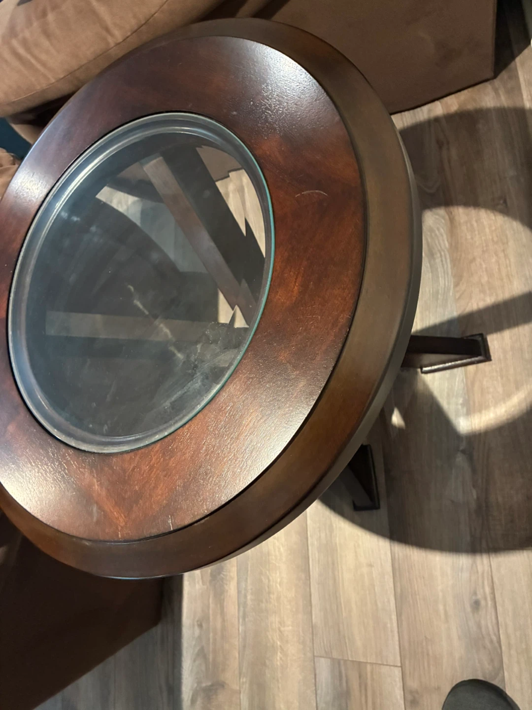 Round wooden side table with glass insert