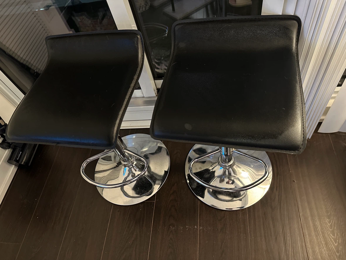 Two Black Adjustable Height Bar Stools