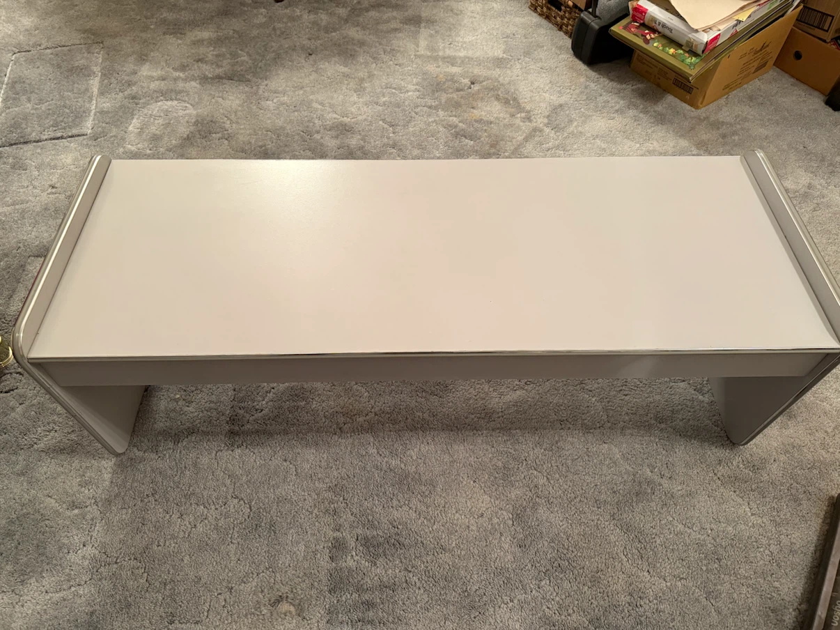Two matching grey side tables and coffee table