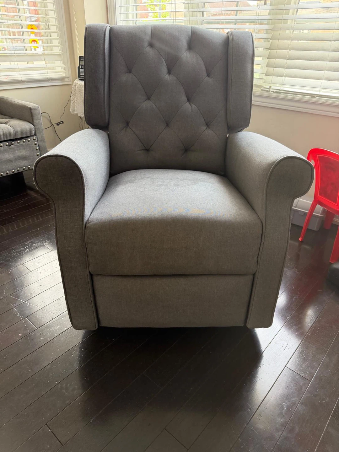 Grey tufted fabric recliner chair
